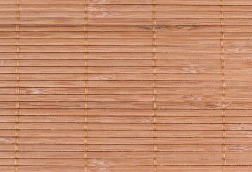 Natural woven wood blinds enhancing the ambiance of a sunlit room.